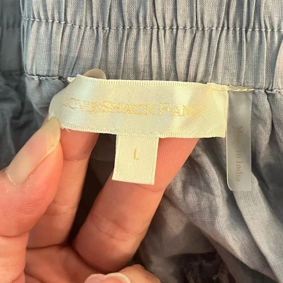 LoveShackFancy Ruffle Mini Skirt in Washed
Denim Hand Dye size L NWOT - Picture 6 of 8